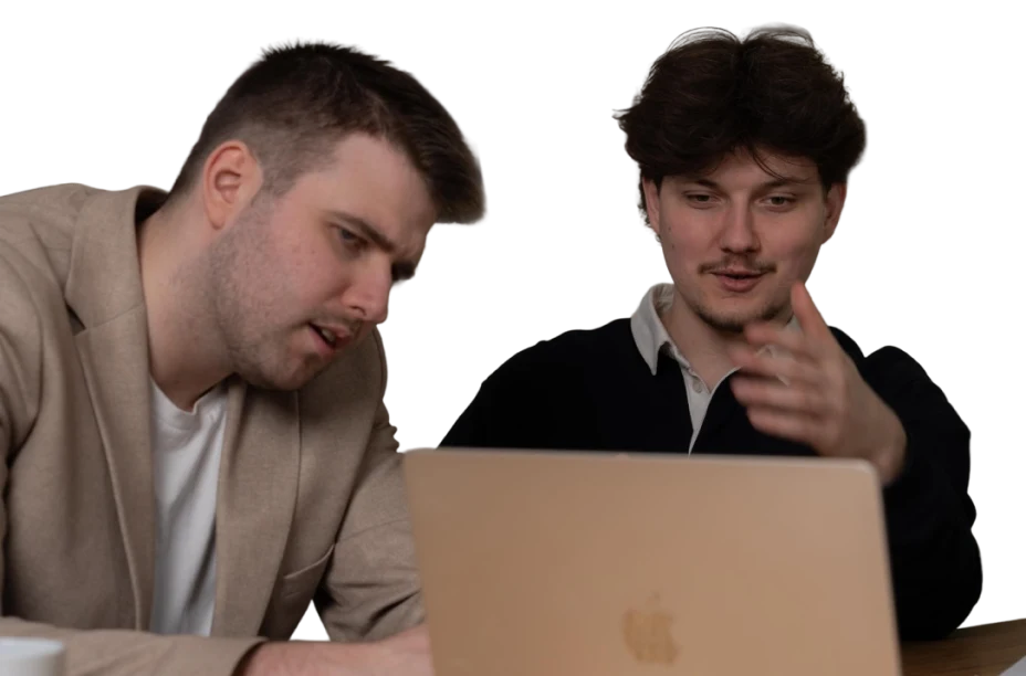 Two WD Market specialists discussing a laptop screen